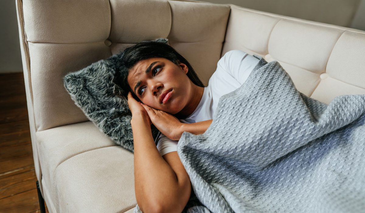 young-woman-lying-on-the-sofa-in-the-living-room-2025-01-08-20-37-18-utc